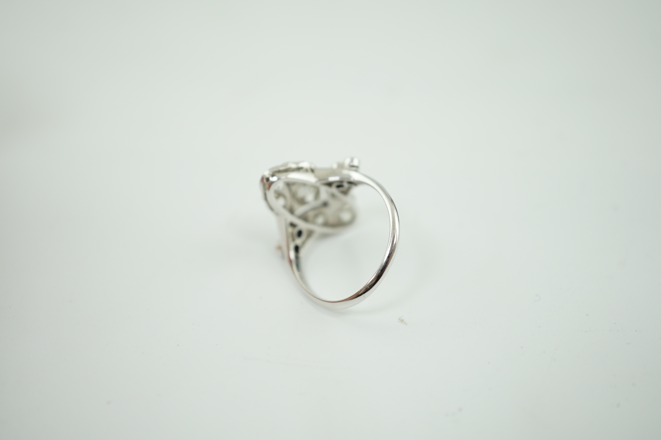 An early 20th century 18ct white gold, platinum and millegrain set old cut diamond cluster ring